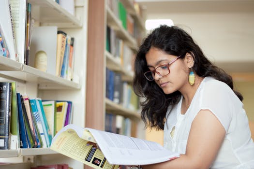 a happy student studying with books