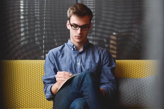 a student writing in a journal